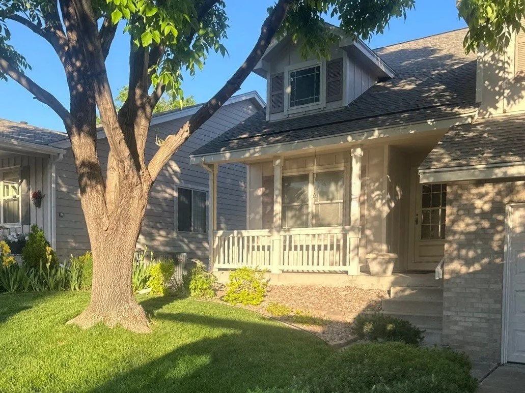 Front porch and garage rooflines of a Green Mountain, Lakewood home with the gutters removed during a hail-claim roof replacement.