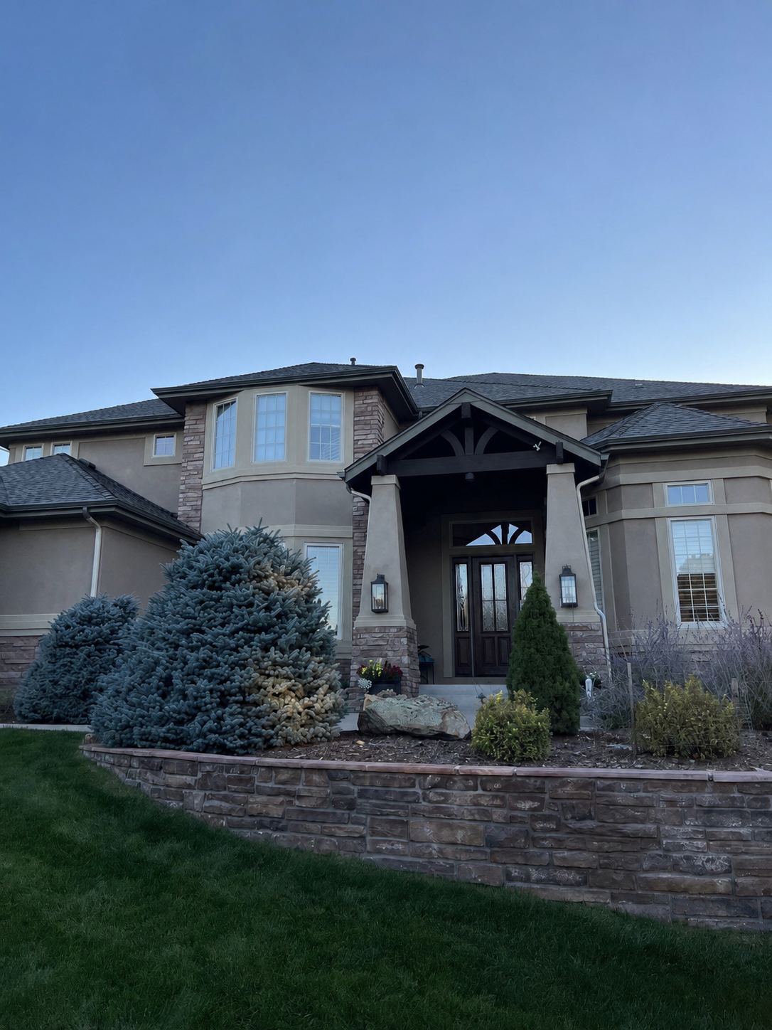 parker-co-custom-stone-home-seamless-gutters.png