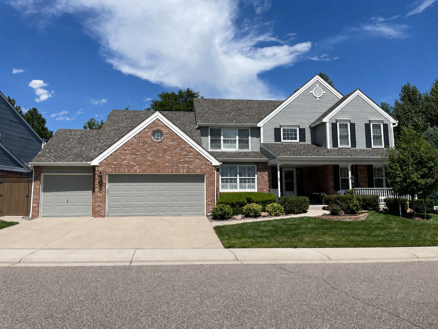 highlands-ranch-co-gray-brick-home-new-gutter-system.png