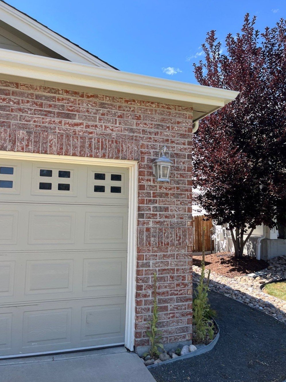 erie-co-white-gutters-brick-garage.jpg