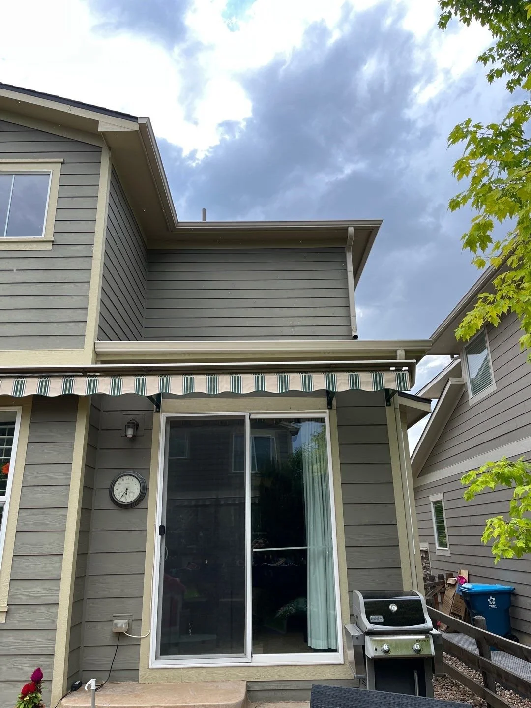 Seamless gutters and downspouts were added above the rear entry to direct water away from the doors and foundation.