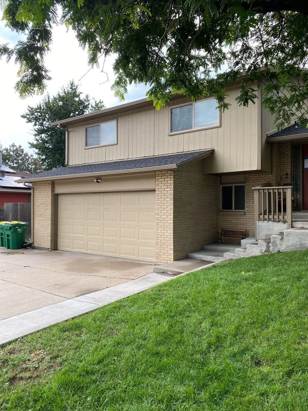 Custom seamless gutters and downspouts installed on a two-story home in Lakewood, CO.
