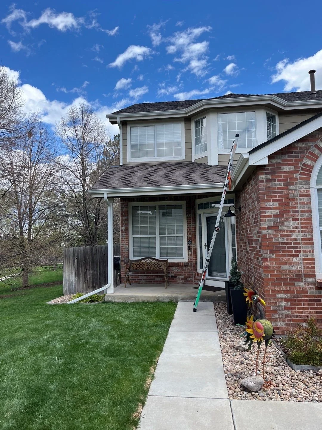 littleton-co-brick-home-front-entry-gutters.jpg