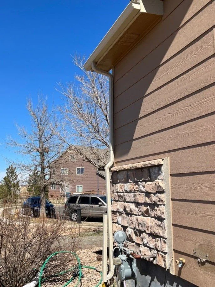 commerce-city-co-stone-exterior-gutter-and-downspout.jpg