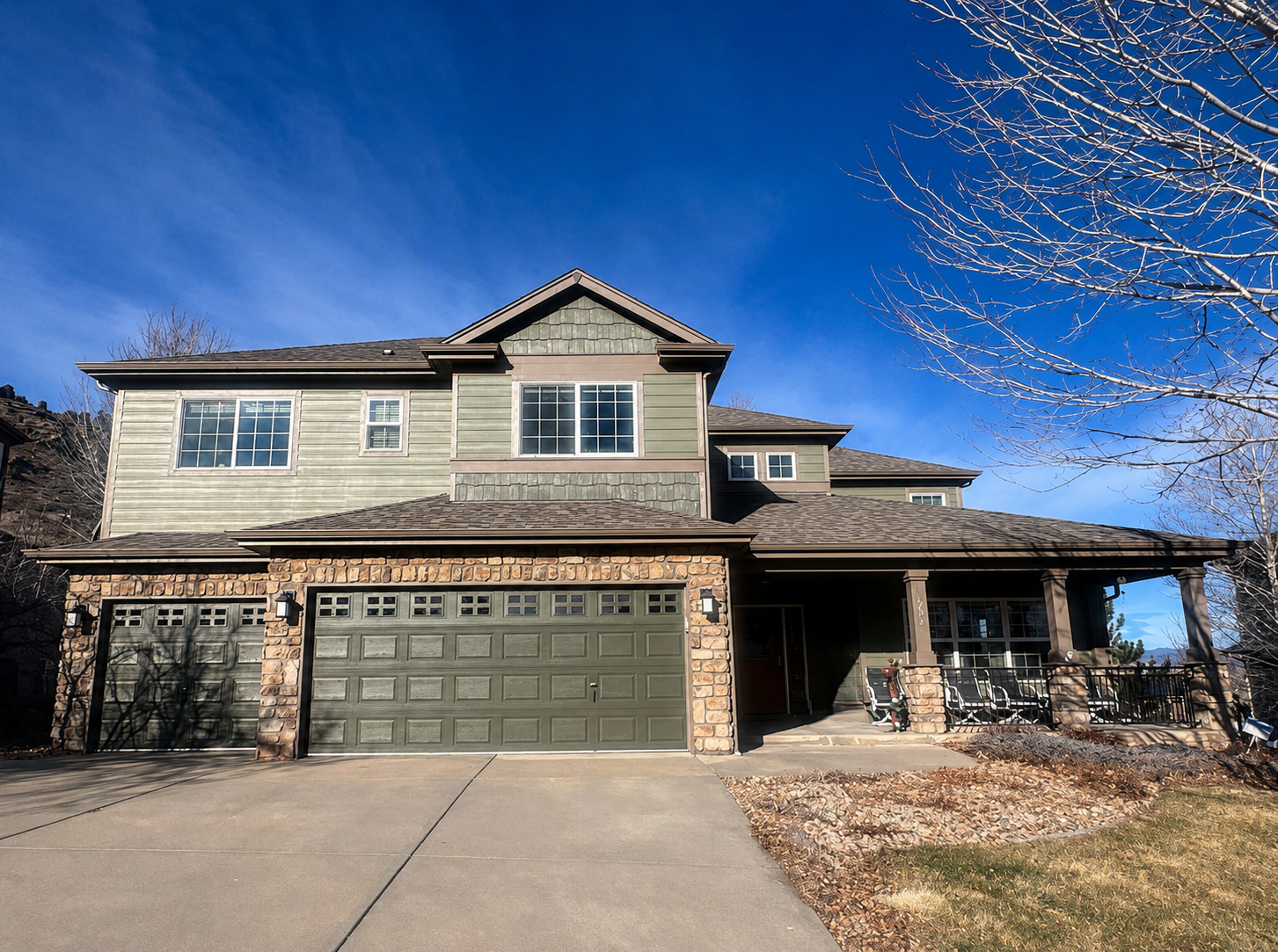 Full seamless gutter replacement on a large two-story home with an attached garage.