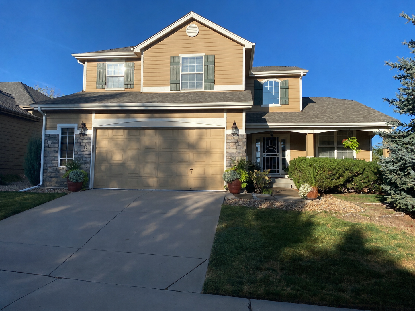 Residential gutter replacement completed above the garage and across the upper roof sections.