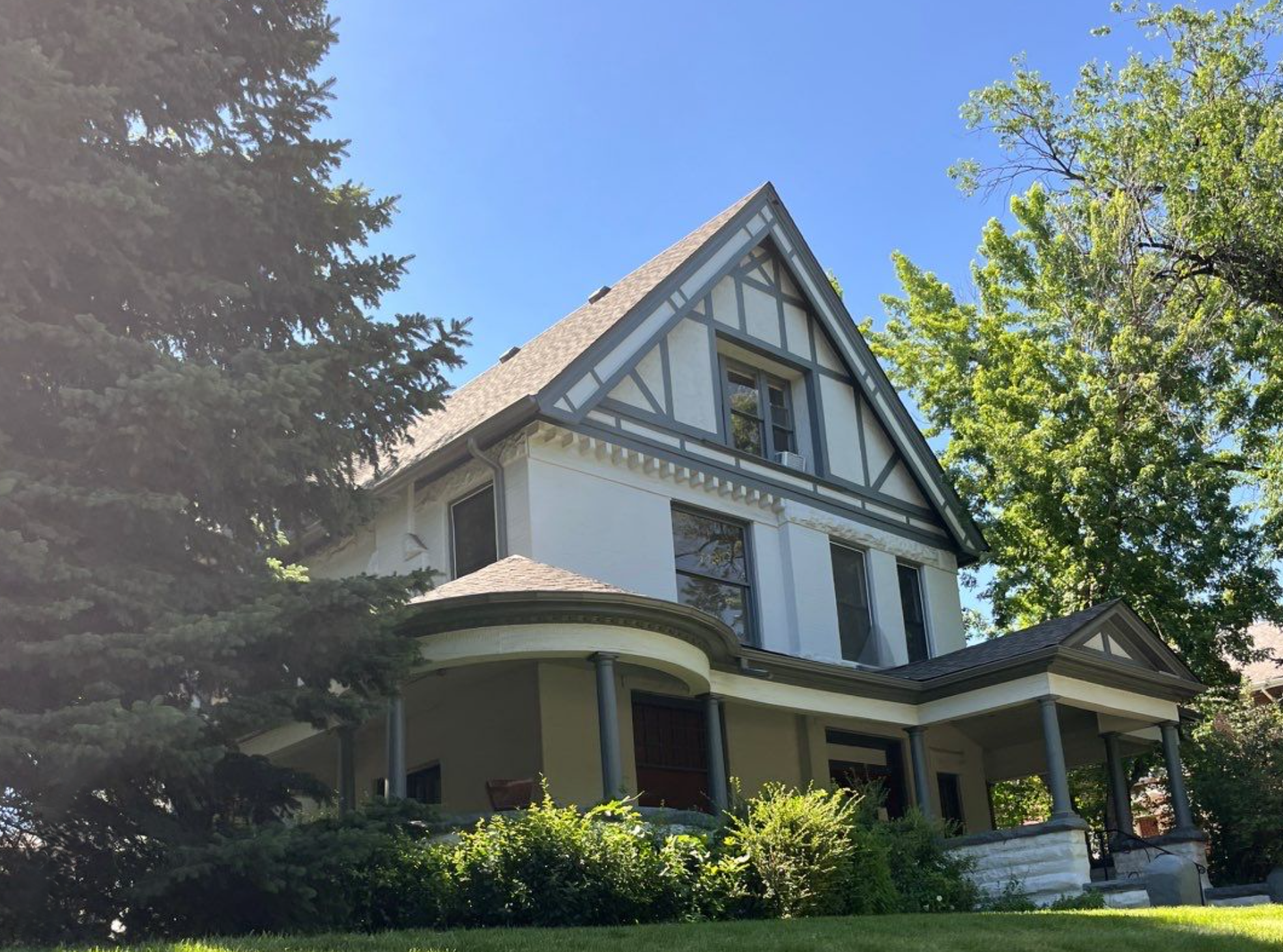 Completed charcoal gray seamless gutter replacement on a Congress Park home in Denver.