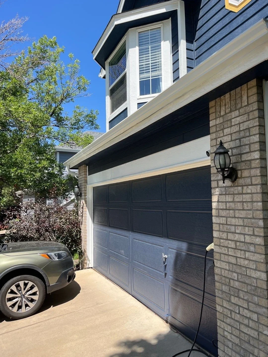 broomfield-co-blue-garage-seamless-gutter-installation.jpg