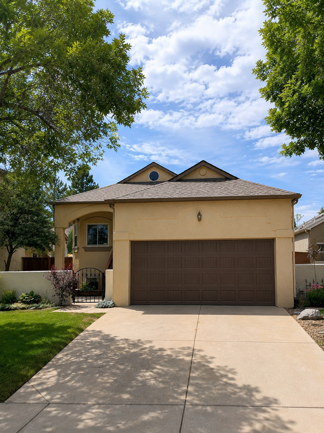 Seamless gutter installation added above the garage and front entry of a single-story home.
