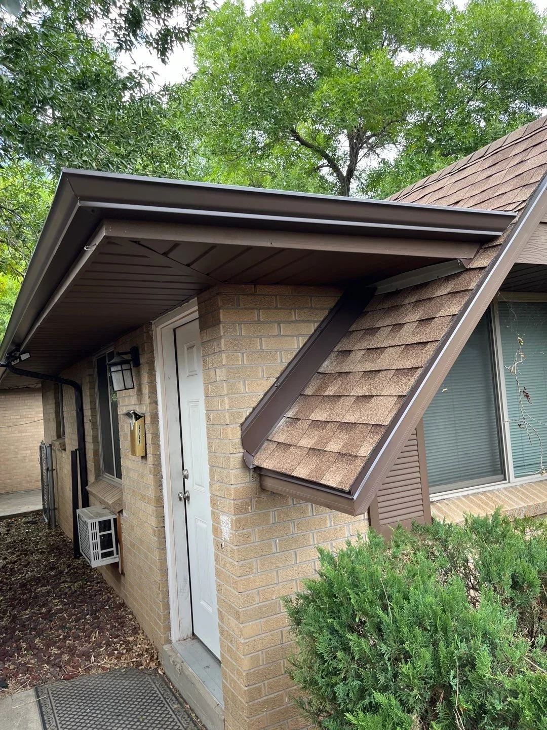 Seamless gutter system installed with a custom end cap.