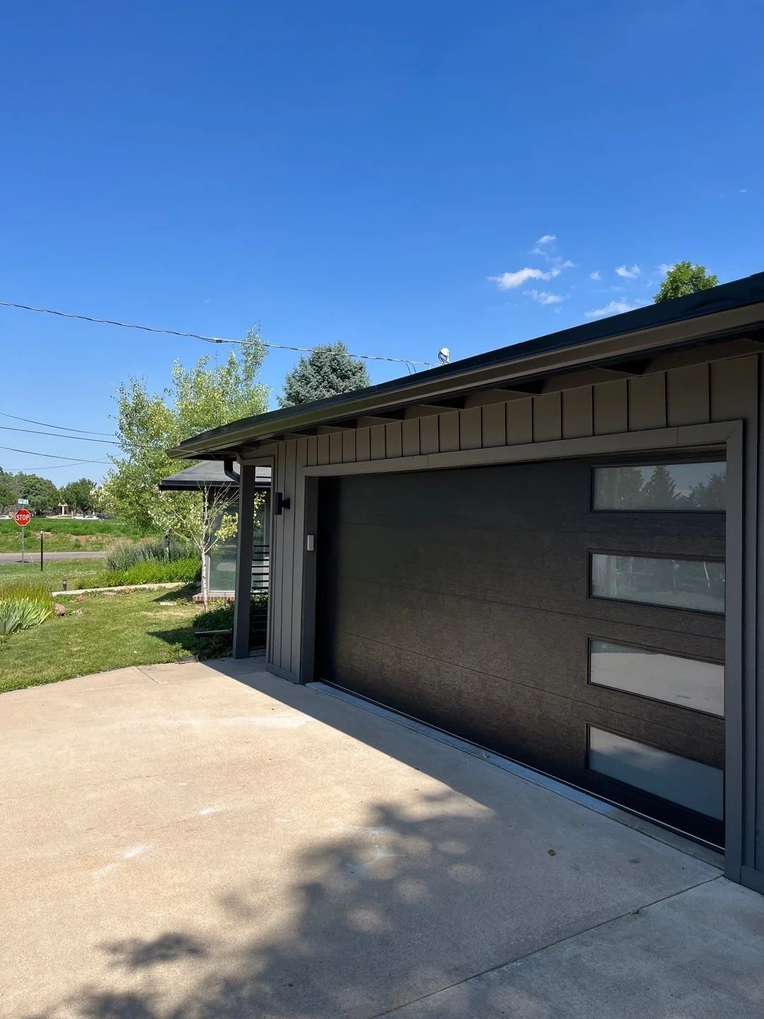 wheat-ridge-co-garage-black-seamless-gutter-installation.jpg
