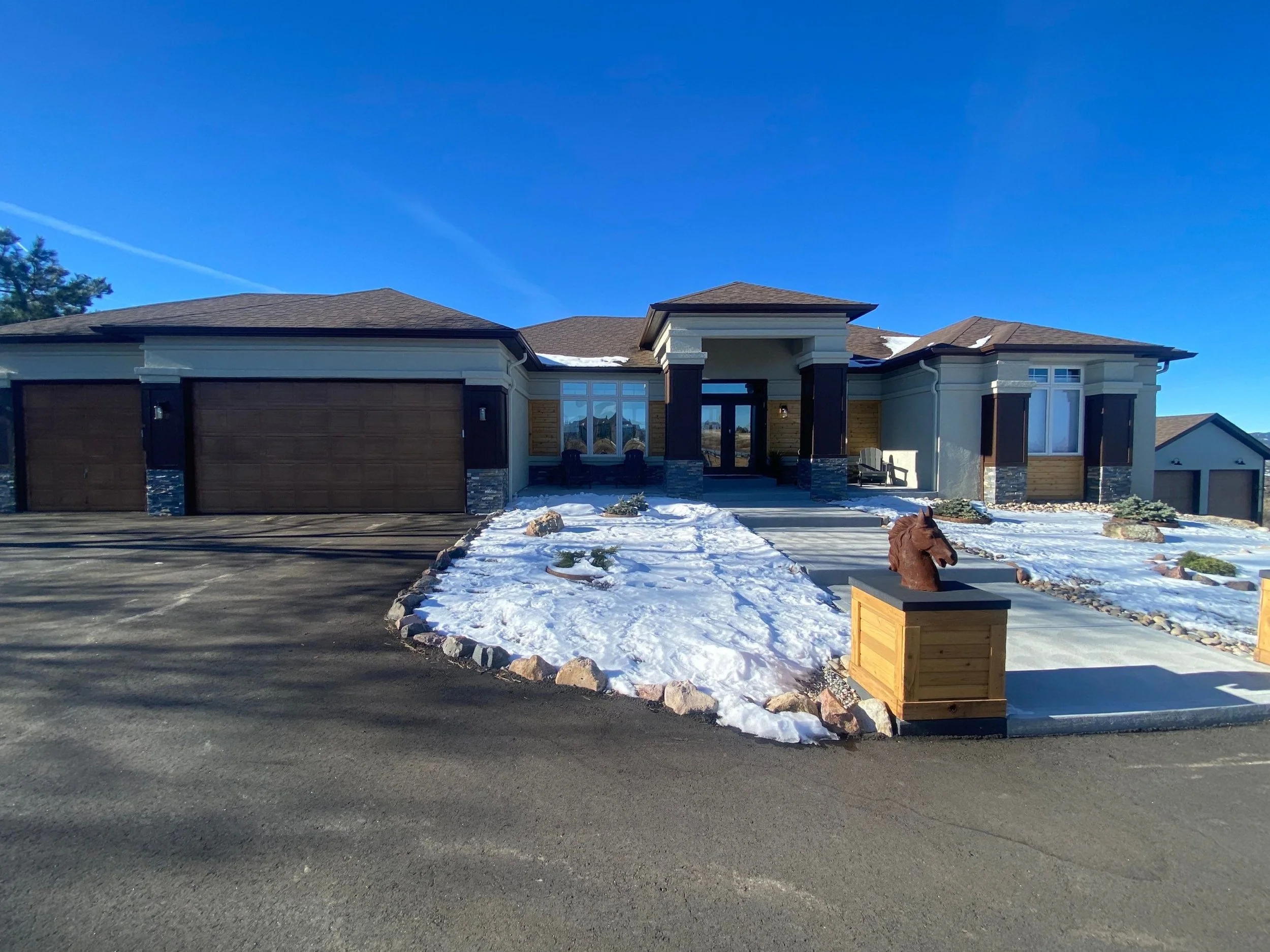 Single-story home with new seamless gutters and downspouts in the Denver Metro area.