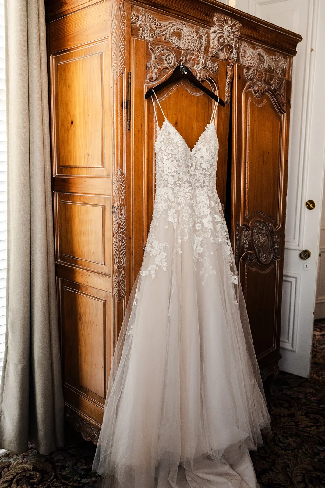 Picture of wedding dress hanging on wardrobe