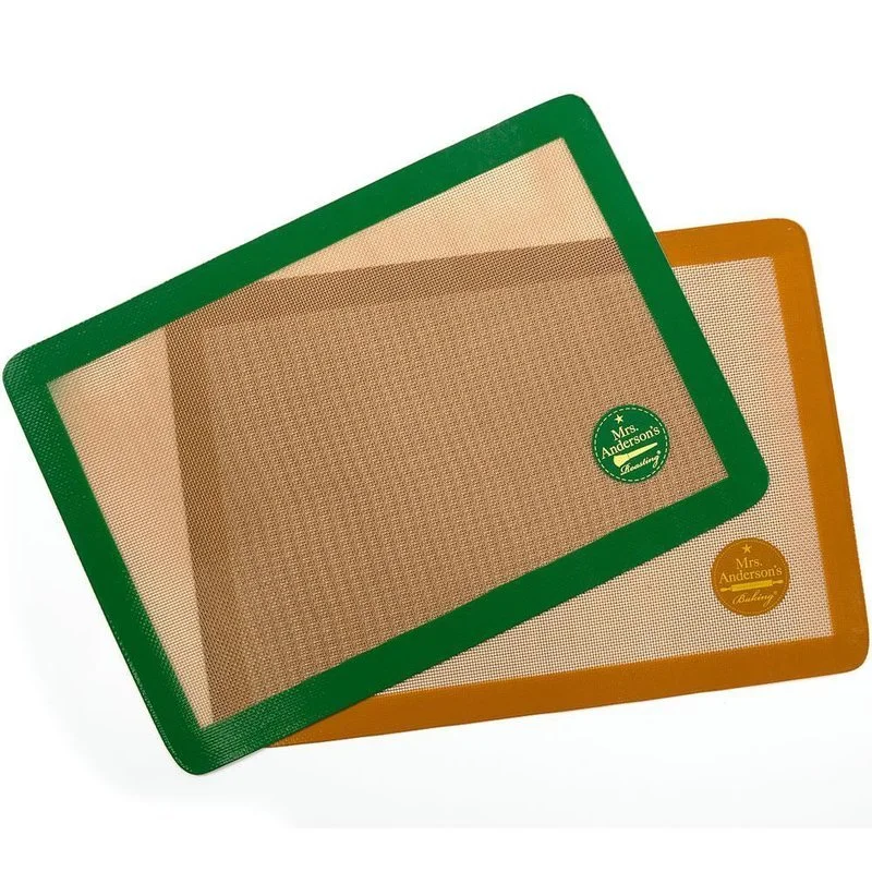 Two rectangular silicone baking mats with green and brown borders, labeled 'Mrs. Anderson's Baking'.