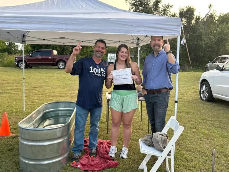 Grant Reed with Scott and Marlowe Overocker after her baptism at Falls County Revival