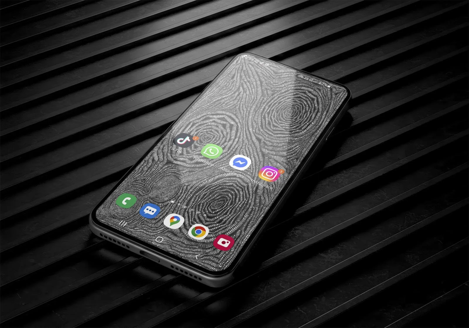 Samsung-phone-with-black-and-white-line-art-wallpaper-with-homescreen-and-app-icons-laying-on-corrugated-metal-black-surface-background.jpg