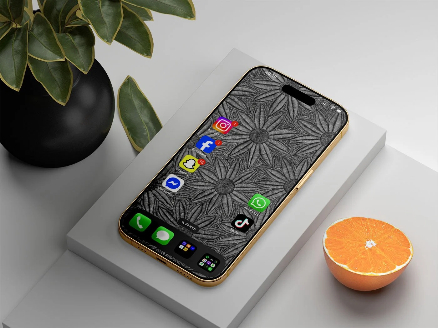 Iphone-with-black-and-white-line-art-wallpaper-on-raided-white-surface-next-to-pot-plant-and-half-an-orange.jpg