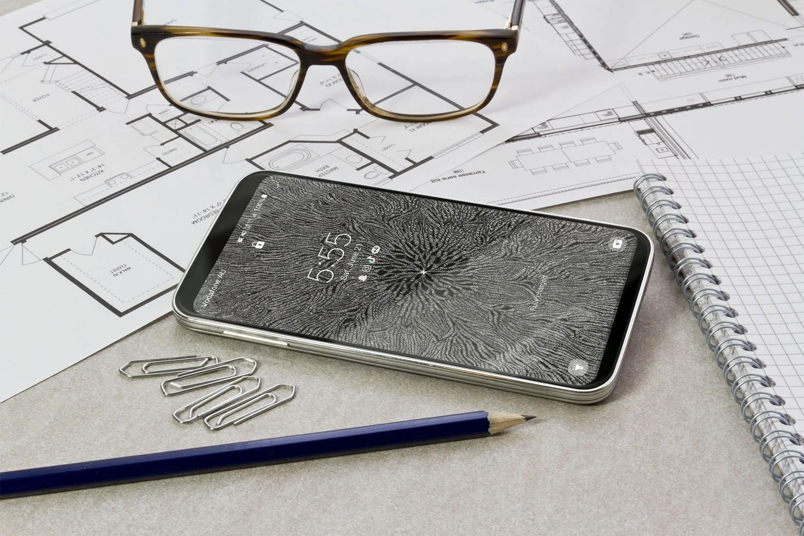 Iphone-with black-and-white line-art-wallpaper-with-lock-screen-over-house-plans- background
