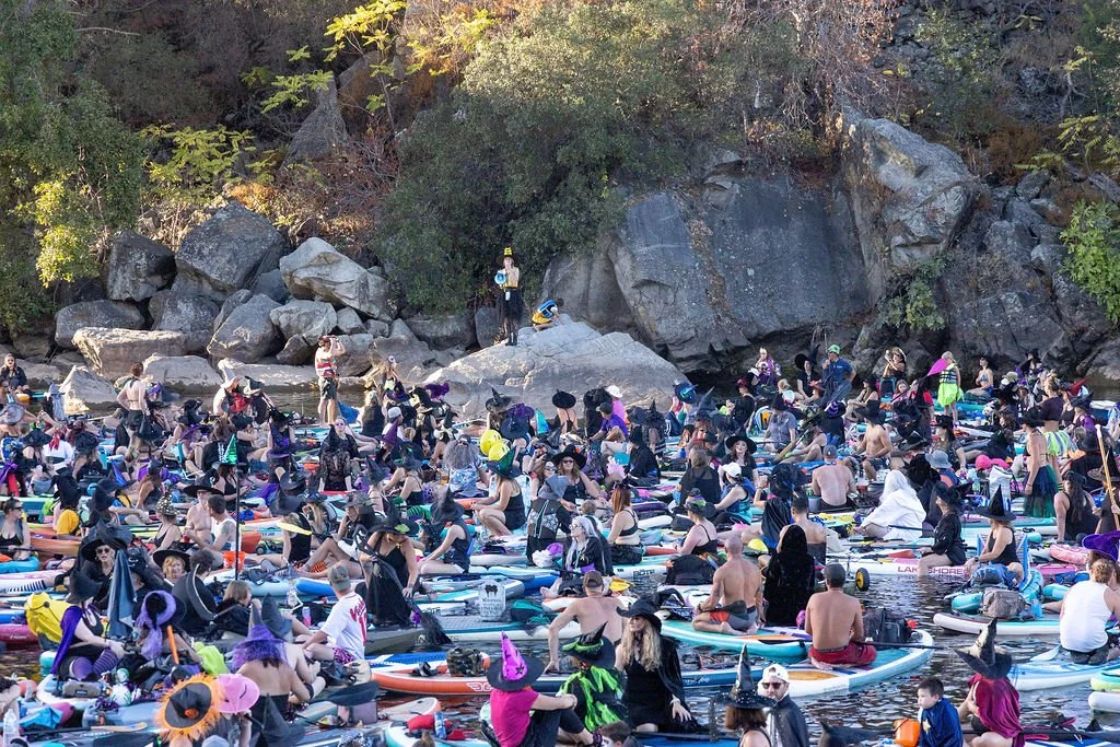 Local realtor Janay Taua addressing over a thousand Witches on the Lake participants on Lake Natoma of Folsom
