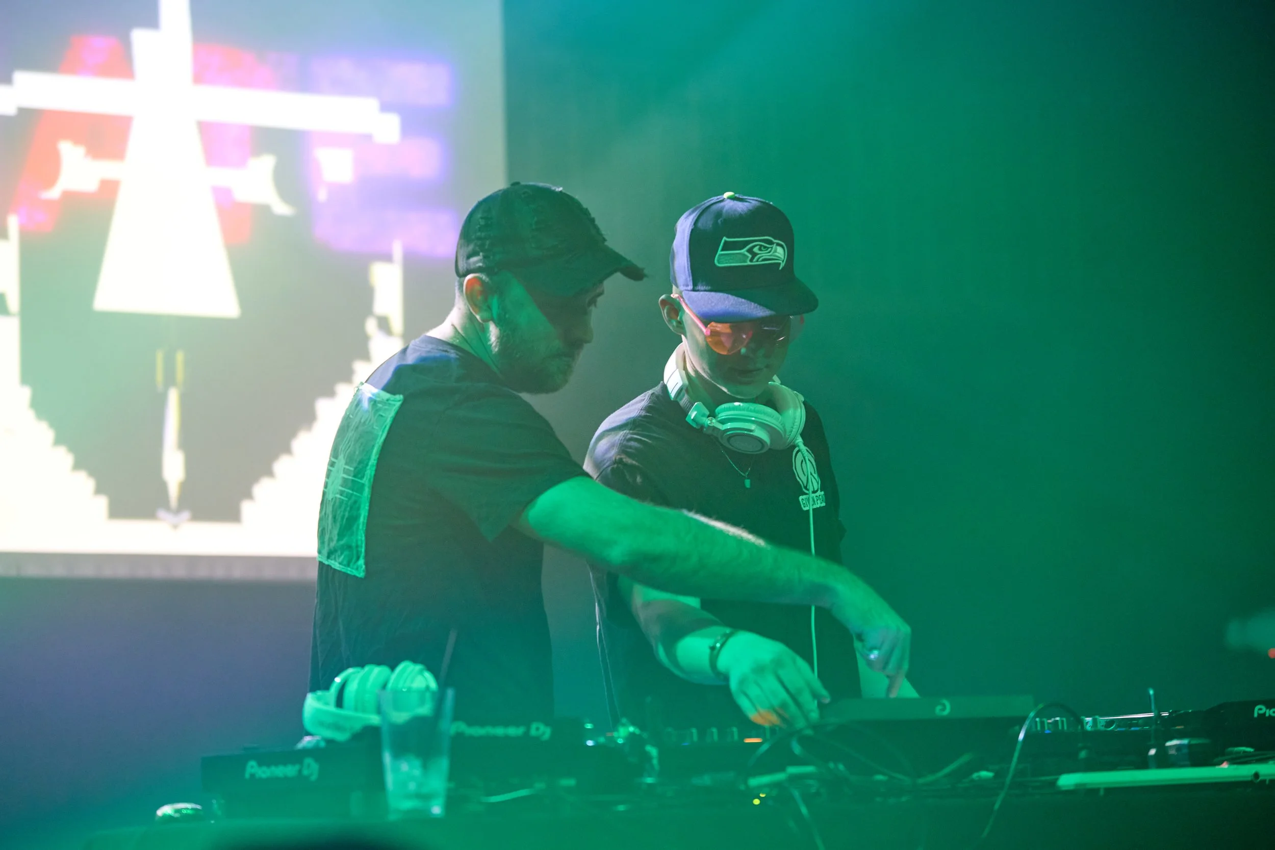 Stage at Ohm on the Range, local Washington festival, at night with lights and people dancing to the DJ's music