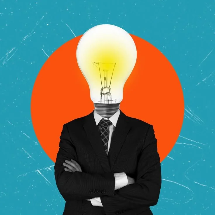 A person in a business suit with arms crossed, but with a light bulb replacing their head, against an orange circle background.