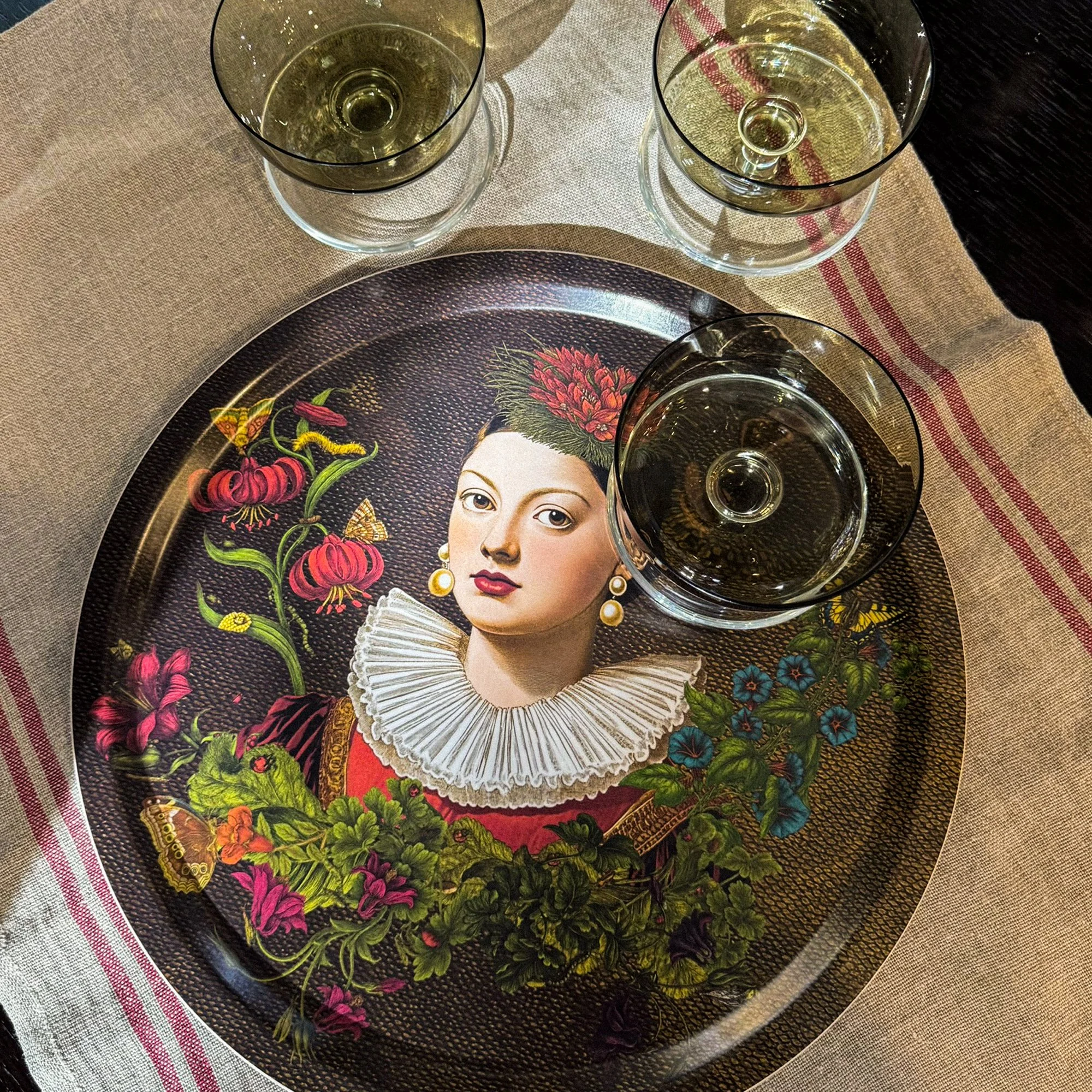 lower Notes serving tray by Laura Molina styled on a table with glassware, showcasing the heat-resistant melamine finish and its use for entertaining