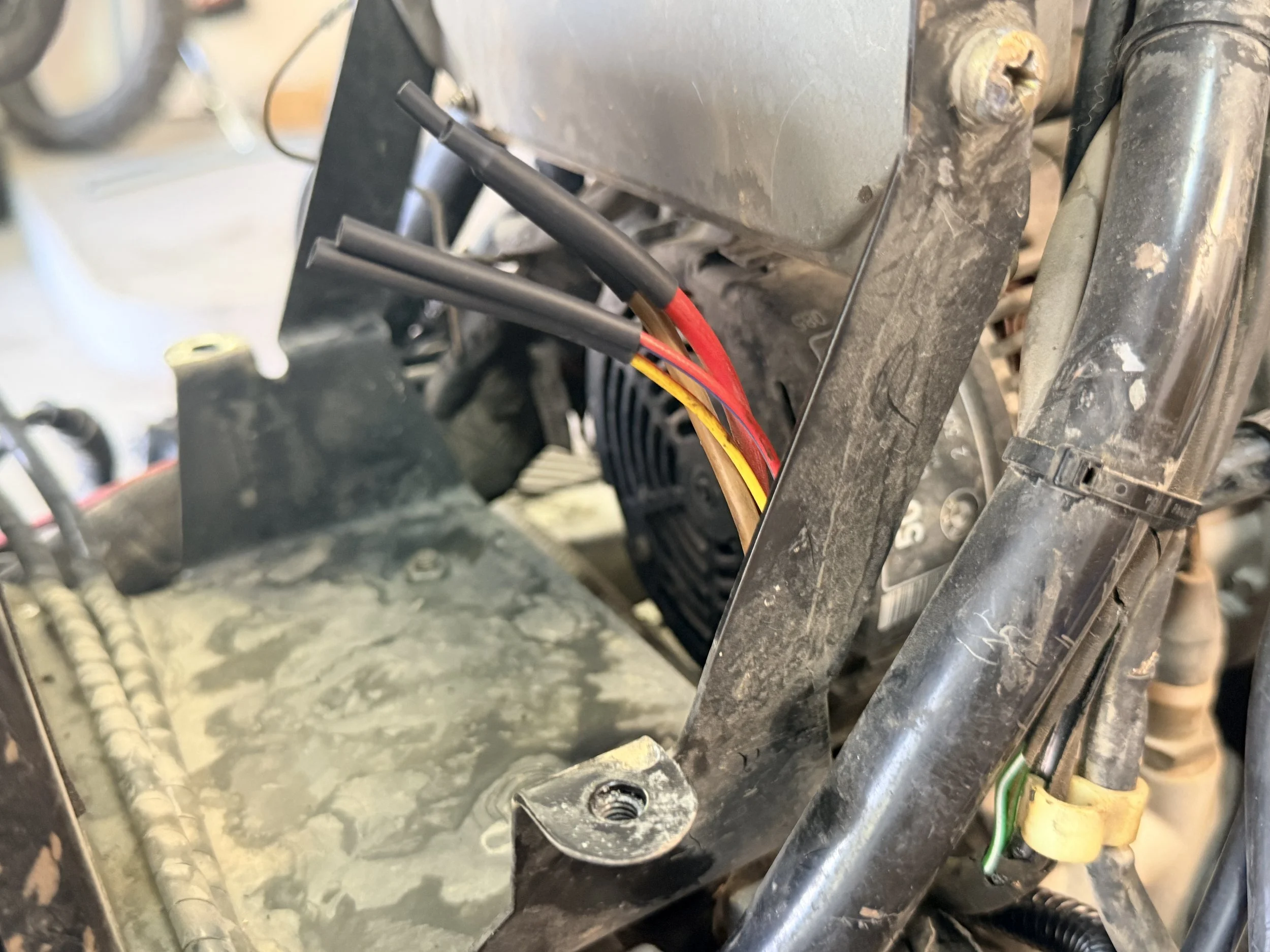 The wiring harness is cut and each line is heat shrinked to prevent any electrical wires grounding or shorting out the system. 