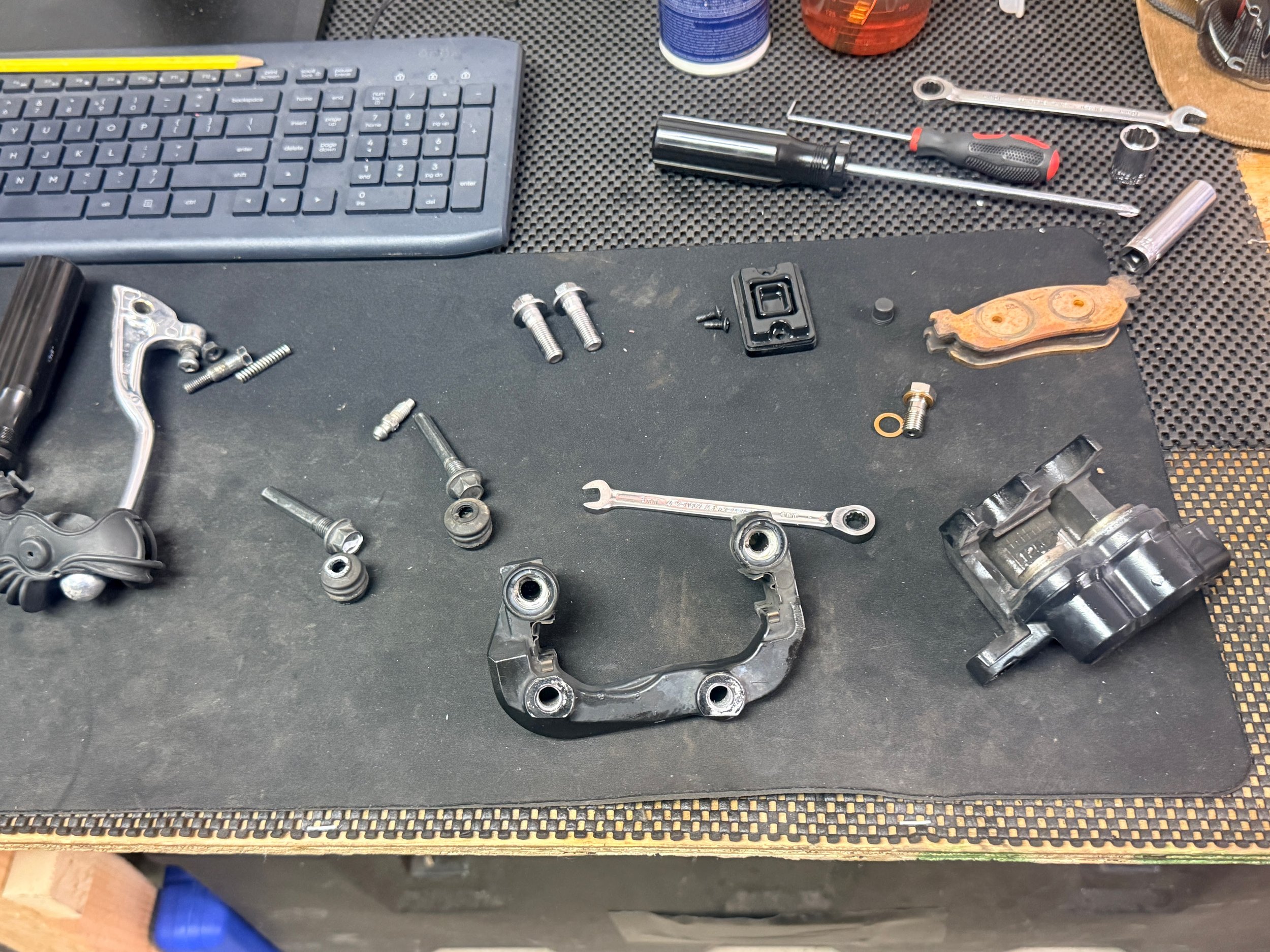 Rebuilding the front brake caliper. We found the problem with the brake pistons (corrosion on them). We buffed, cleaned, lubed, and rebuilt.