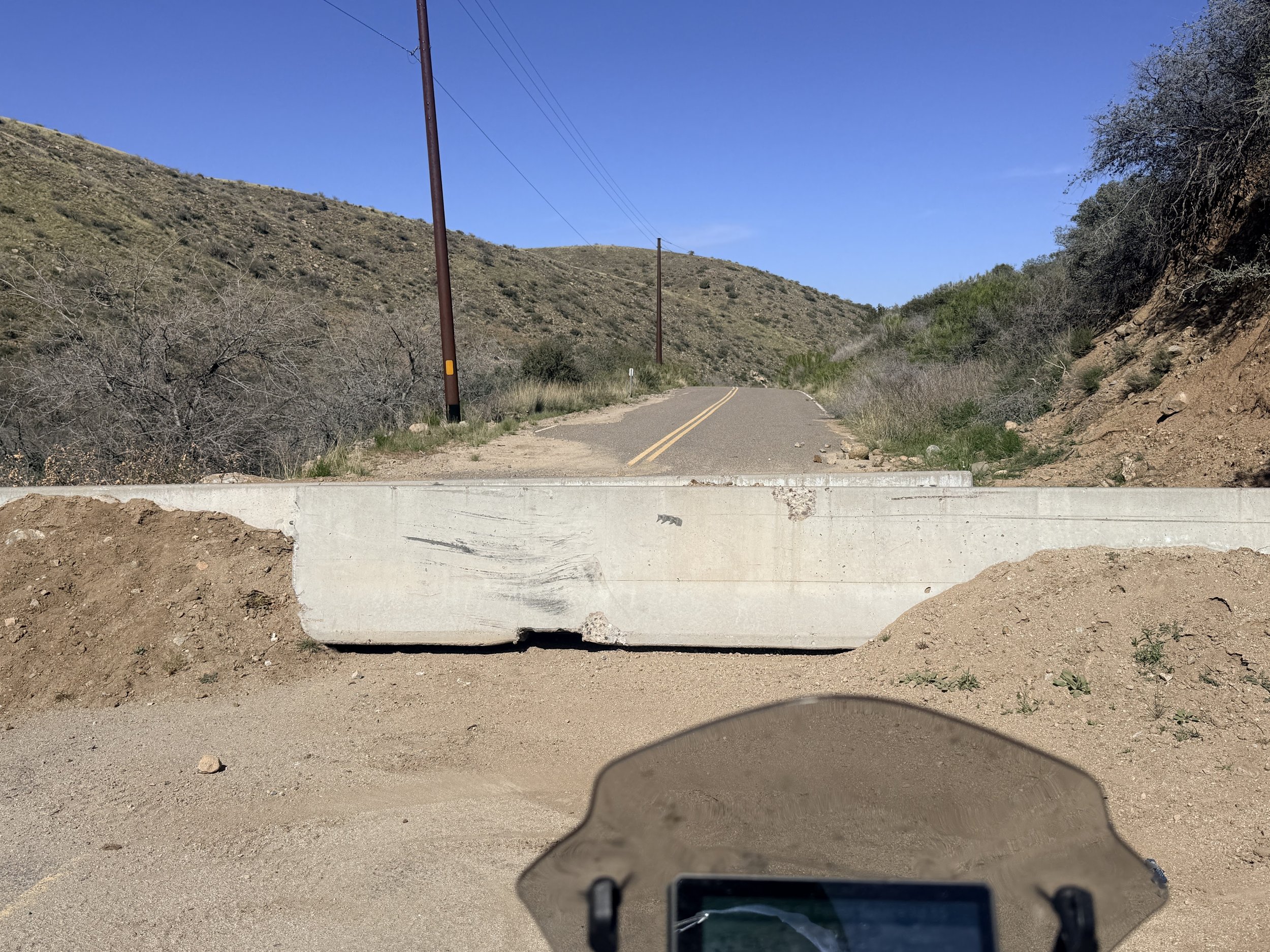 Evidence and reminder of the destruction the recent floods brought to the community. Road closure turned us around. 