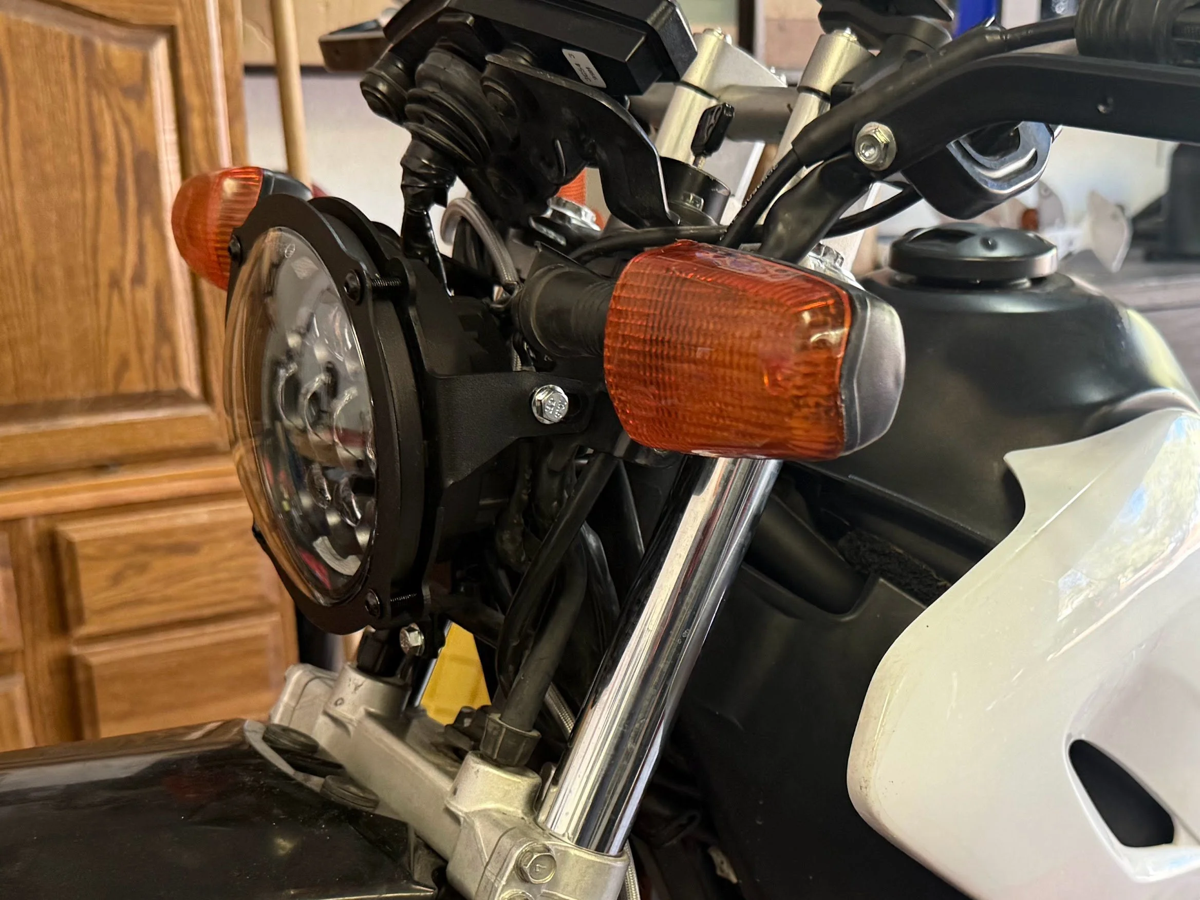 The headlight assembled. I used from blue thread locker on the bolts to give some security. They are so bright, it's easy to adjust them during the day in the garage. 