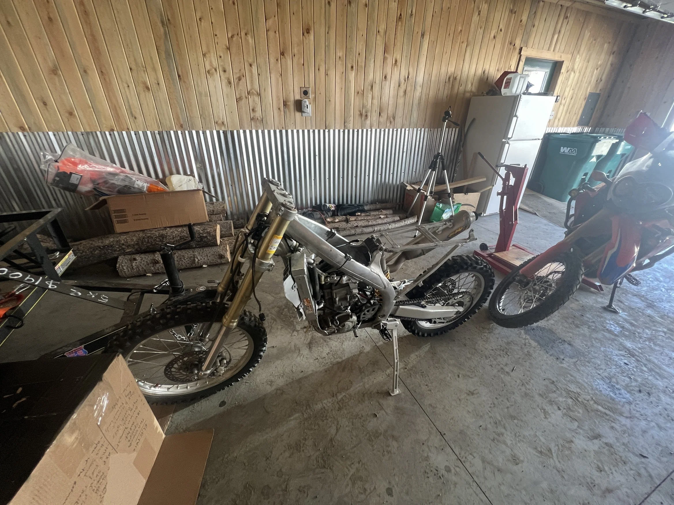 Got the triple tree, front forks, and wheel back on as well as the rear wheel - starting to make progress. 