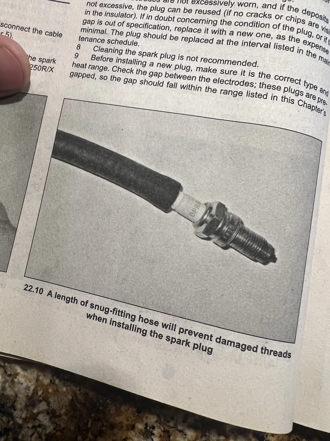 Should have read the manual before taking out the spark plug. 