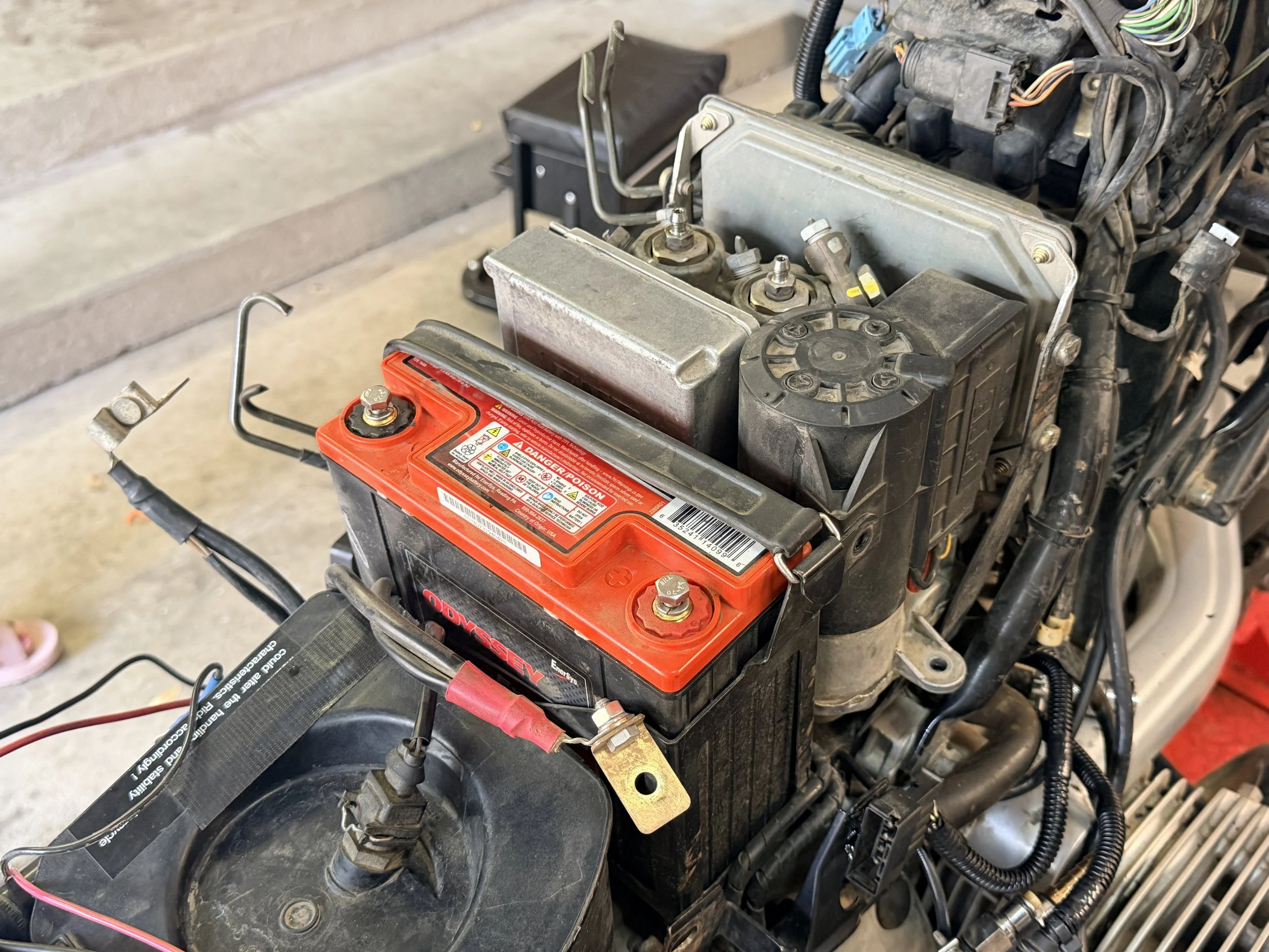 Preparing the ABS for removal requires the battery to come off so that ABS wiring harness can be cut. 