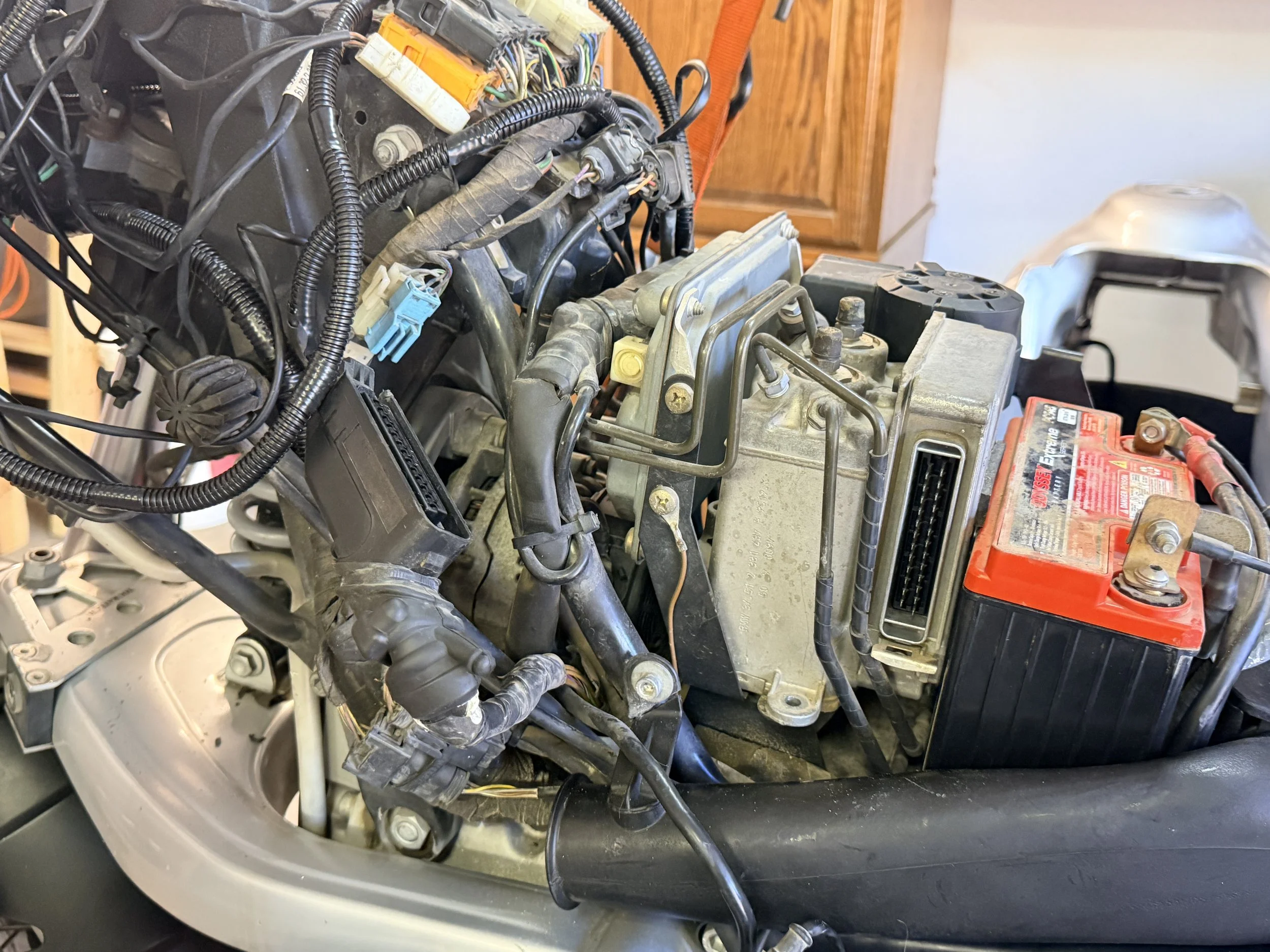 Off the ABS unit that was not functioning. Dead weight that needed to go. I removed the computer plug to test & ensure that it didn't affect the brakes electrical circuit. On this model, it doesn't - off we go. 