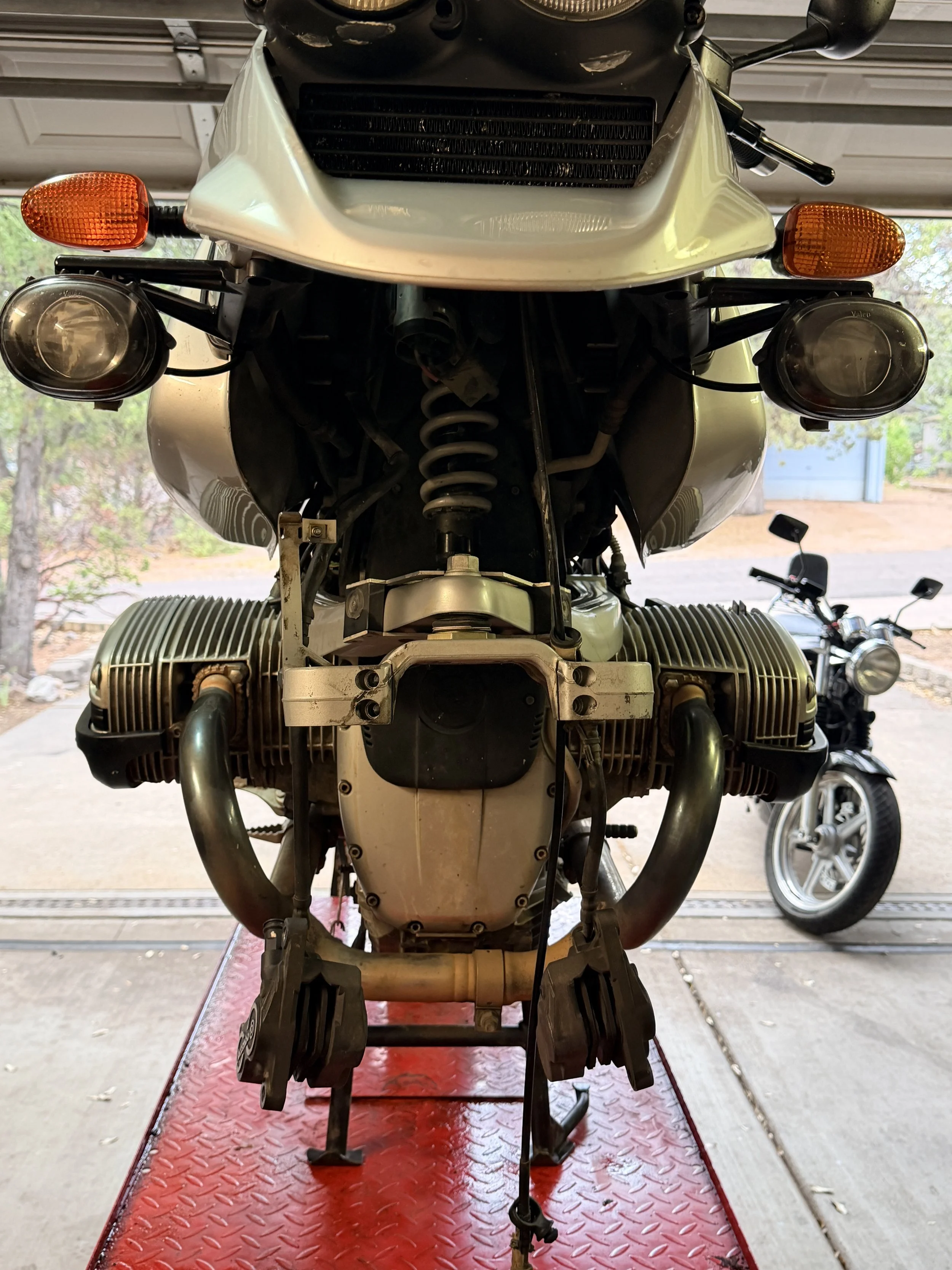 Off came the front end to being the wheel rebuild & the front fork repairs. The clutch cover showed signs of leaking - it hasn't since, and I cannot find the original source. I lean towards front suspension leaking although not obvious. 