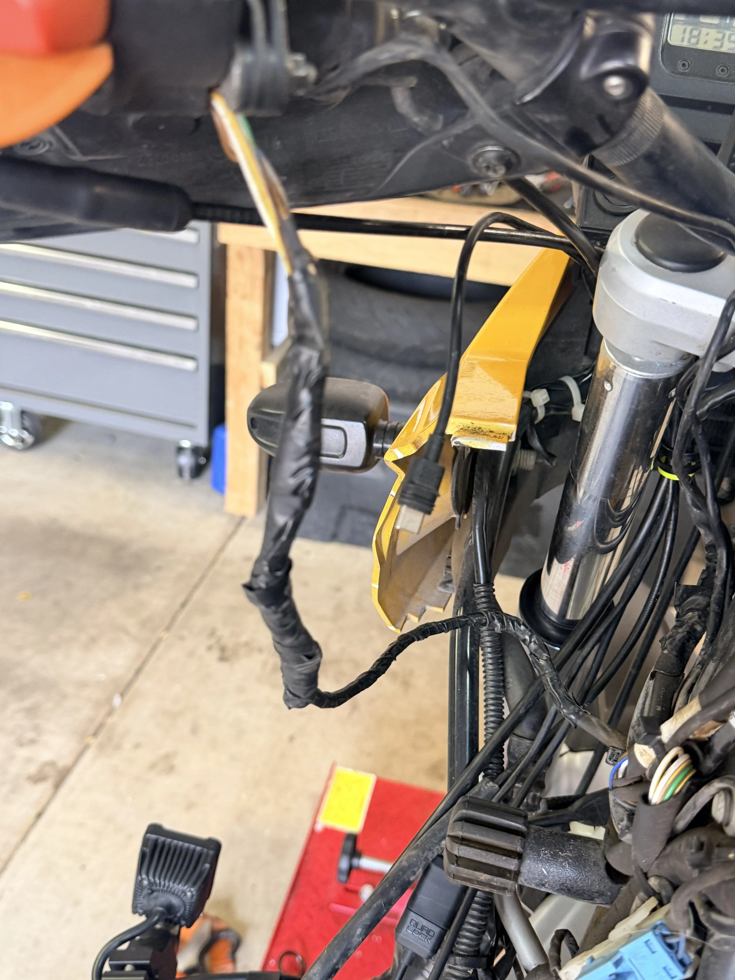 A lot of exposed wiring, electrical tape hammered by the heat, and opportunities for serious problems long-term. 