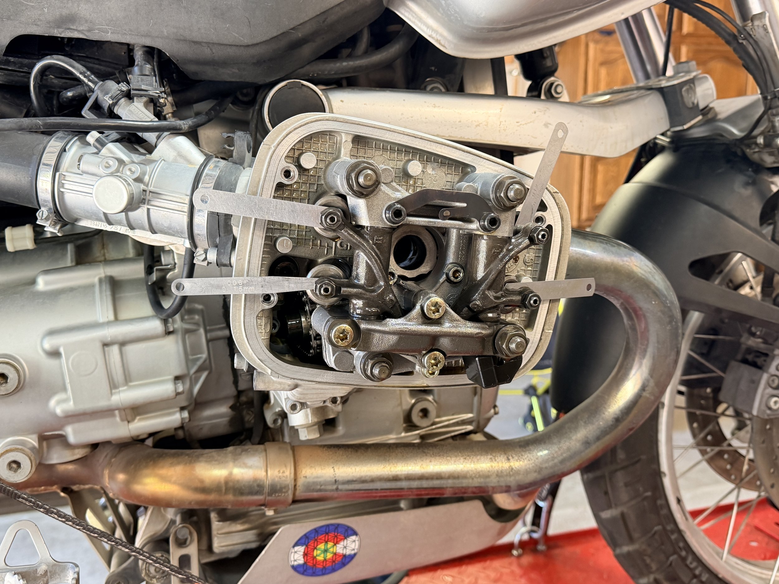 After the careful game of back & forth, the valves are set to .15mm intake & .30mm exhaust. In time - those will get played with to fine tune. Now - textbook. 

The left cylinder - wildly off - rotated the engine to the correct position for left cyli