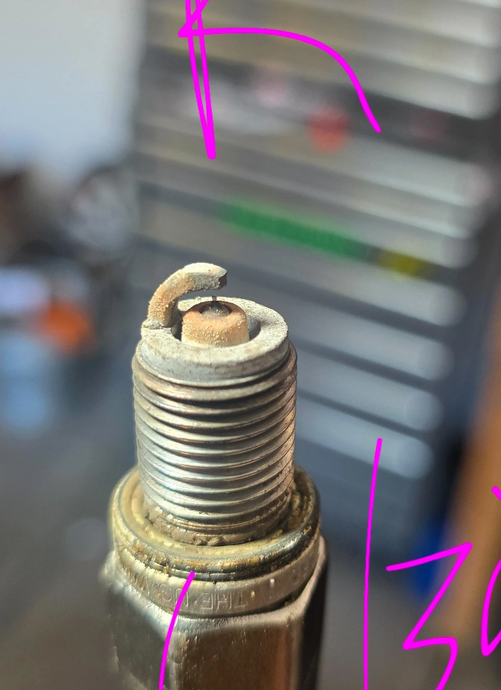 Spark plug with 12k miles on it. Not bad. One cylinder was running a little lean. The other cylinder running very perfect. The valve adjustment and throttle body synch should really help with this. 
