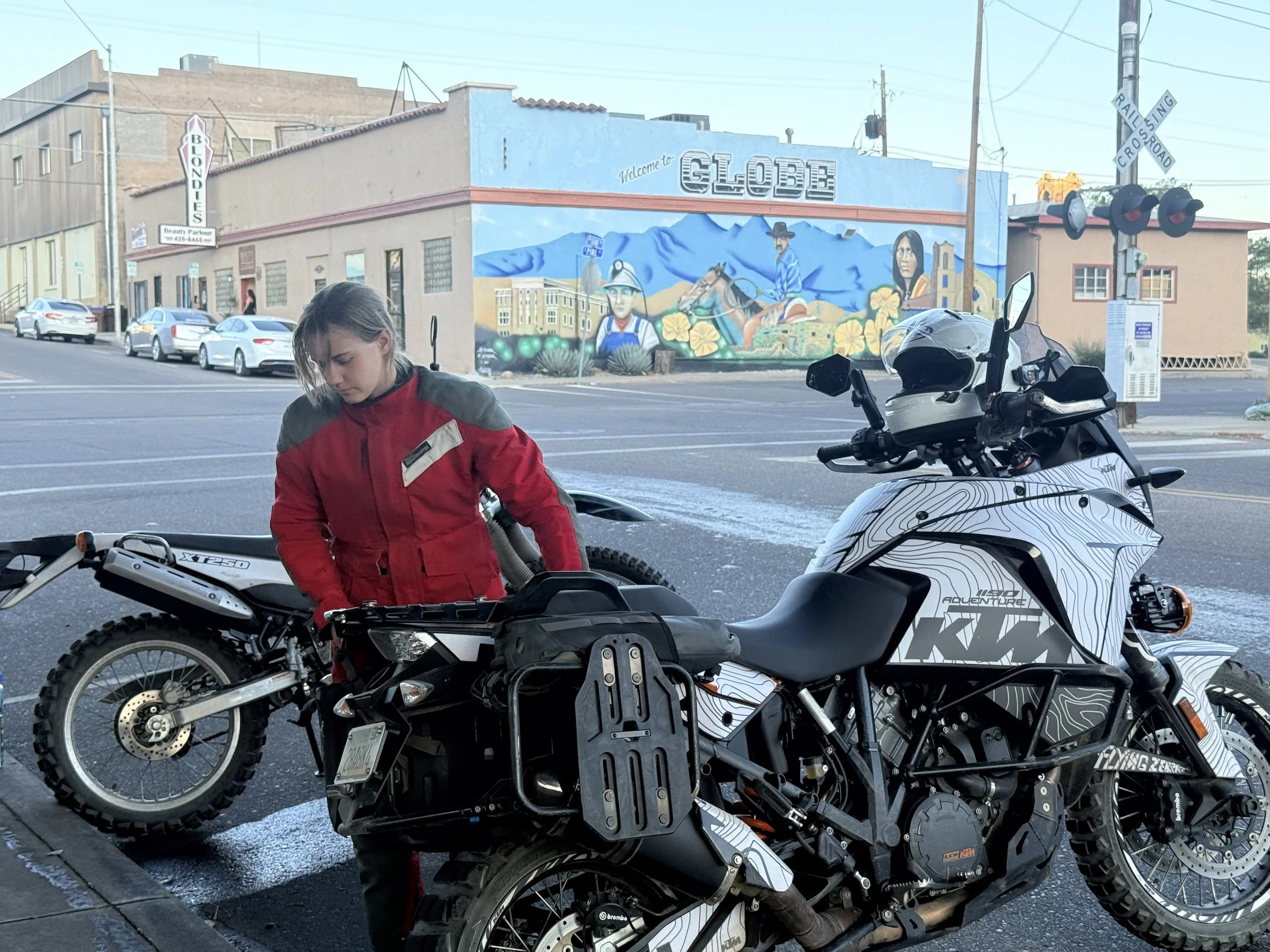 Front brake seized. The water under her bike evidence of us trying to cool it quickly. 