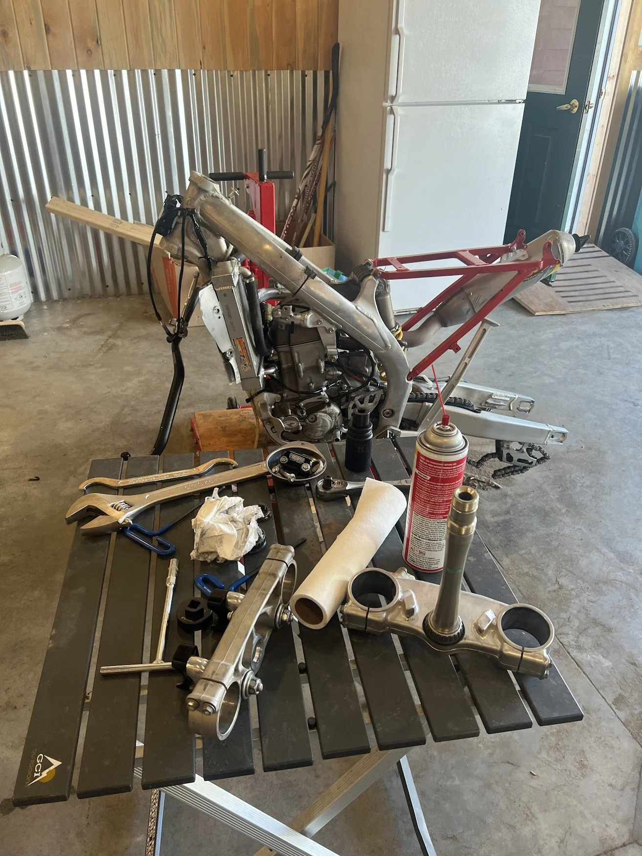 Probably at its lowest point. Almost down to engine and frame. 