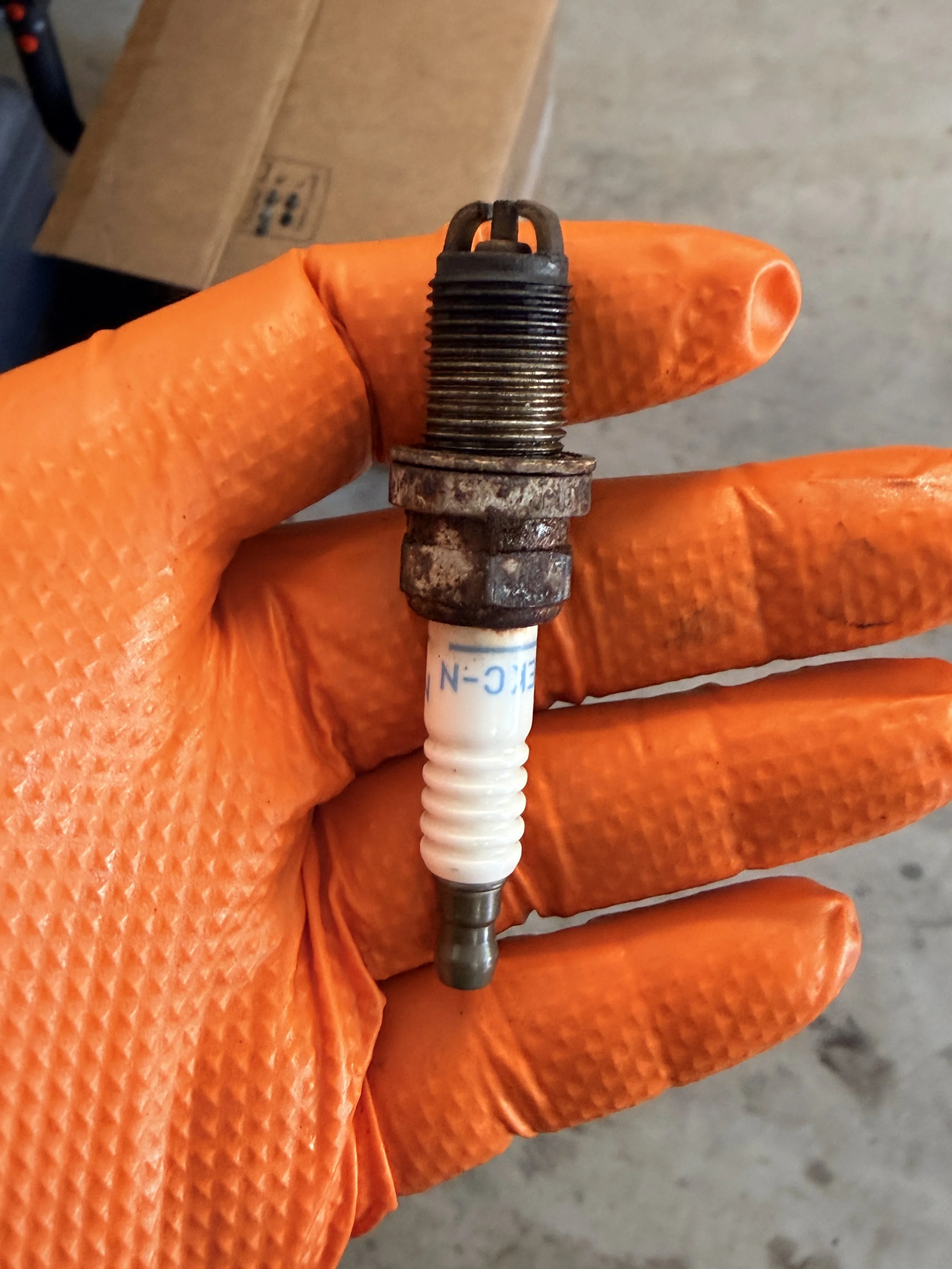 Reading the spark plugs - a sad day that the plugs showed significant signs of wear but not enough to read properly. Perks of 1k miles in 6+ years. No signs of a serious problem. 