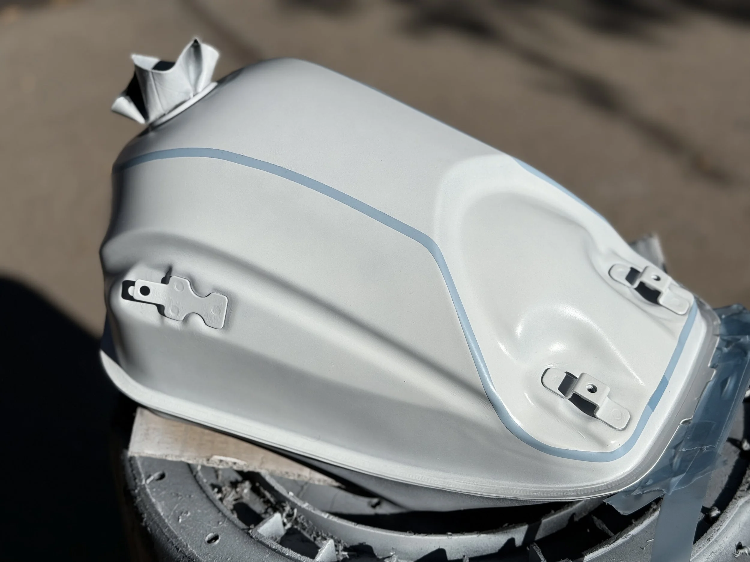 Base coat is on, and the lines are in. Taking the lines all the way down the side of the tank was a massive improvement to the overall look. 