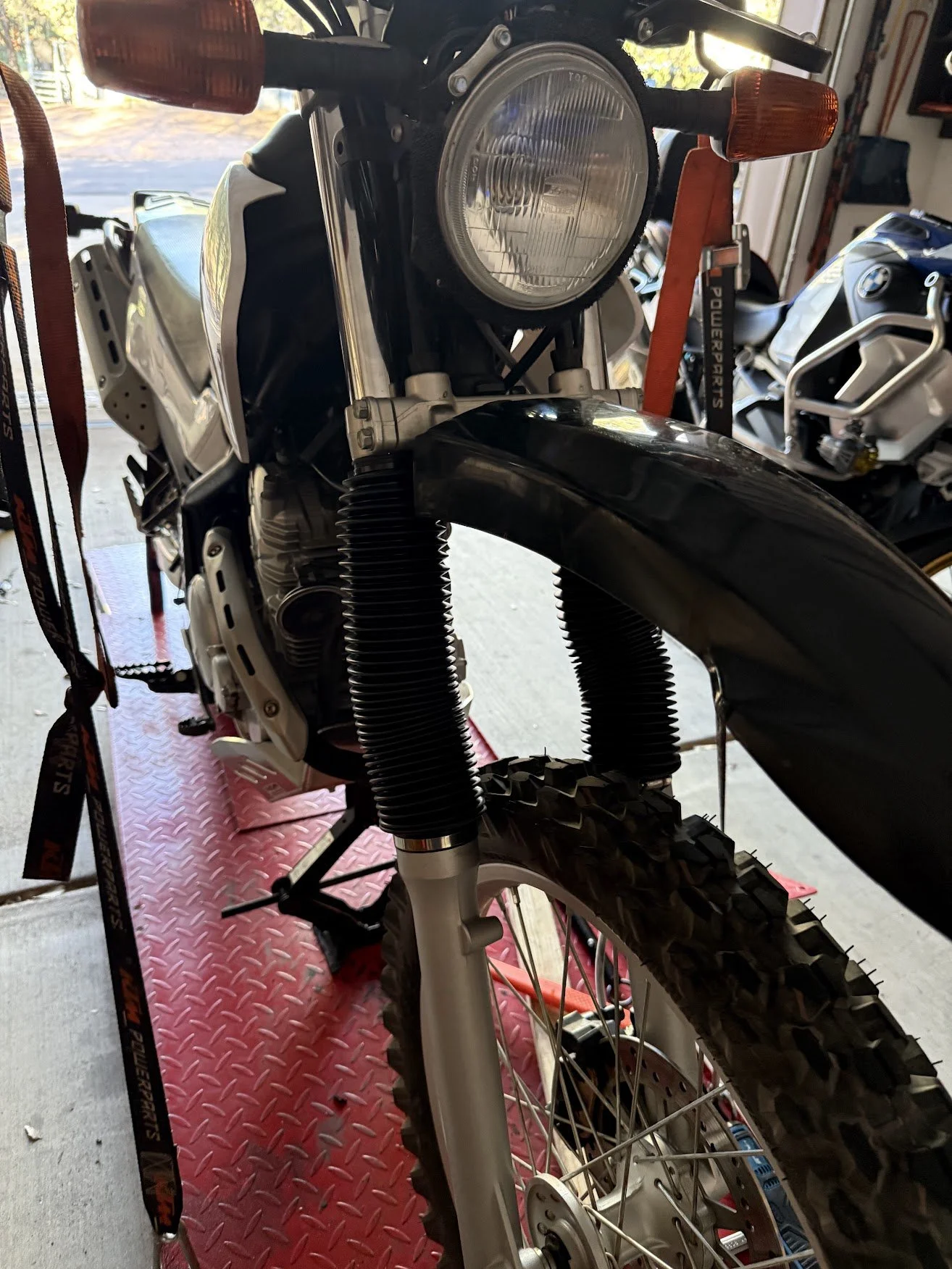 These are aftermarket boots on Amazon. They aren't even remotely as clean as the OEM ones, but the OEM fork boots are insanely expensive online ($65 per boot) - no thanks! 