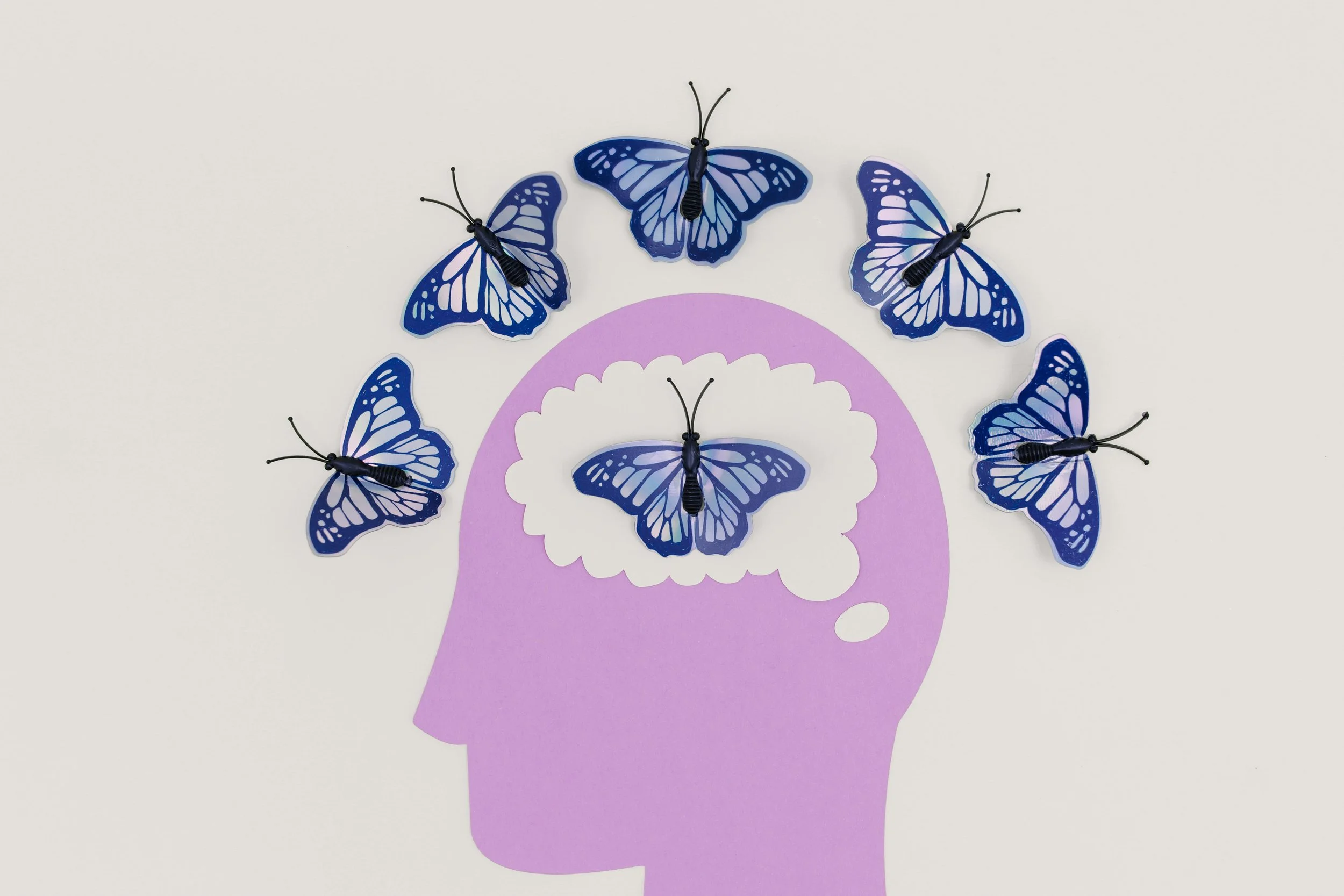 brain with butterflies depicting Michal Goldman LCSW marriage counseling queens interviews Dr. K C Buggs about neuropsychological evaluations