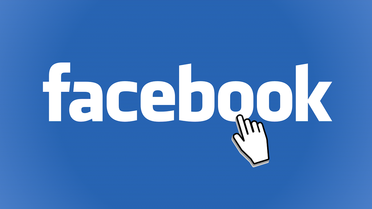 Facebook logo with a cursor hand icon pointing at it.