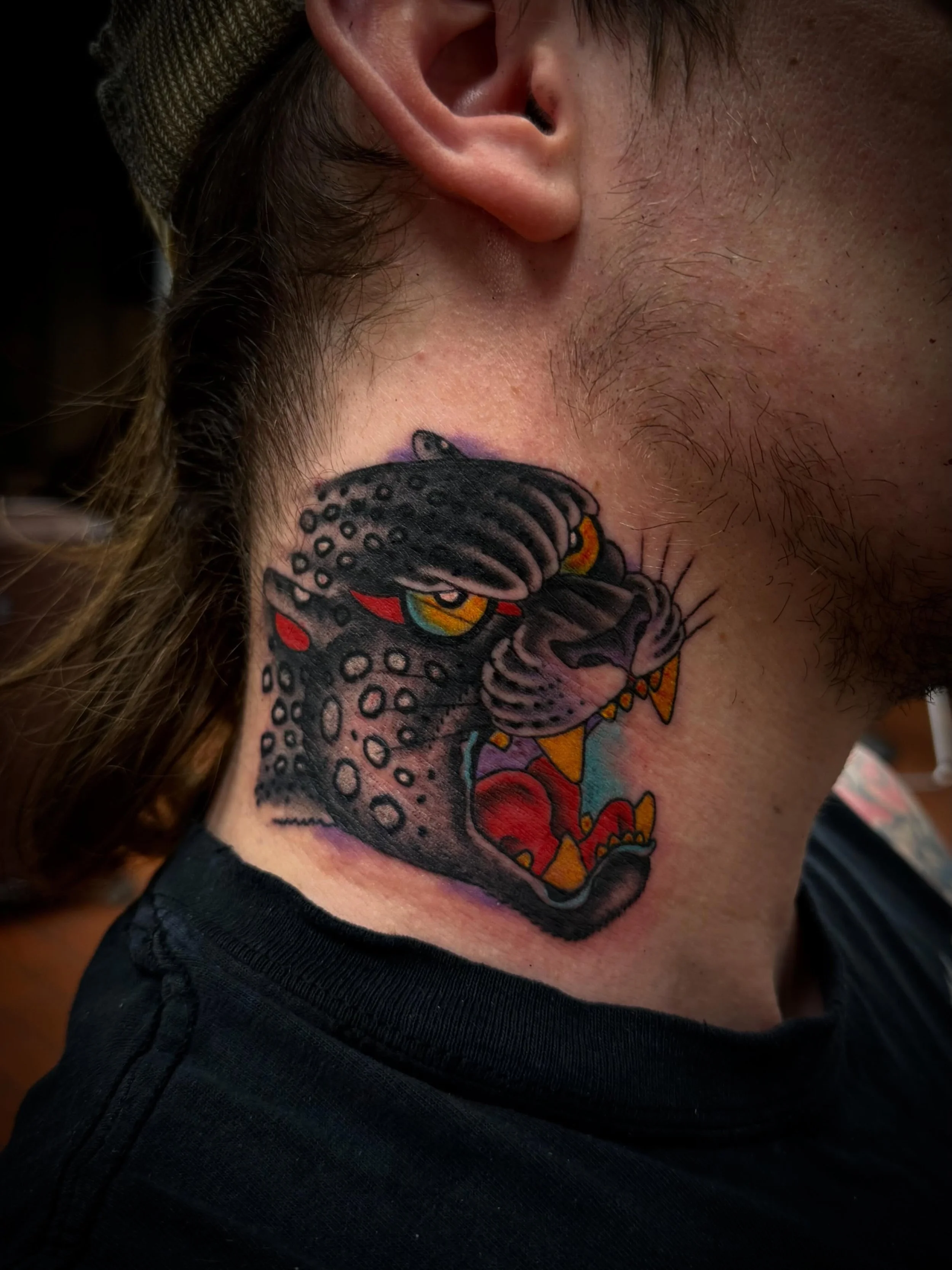 Big cat on the neck. Done @freedominktattoos with love. Back @elmstreettattoo Friday. Check the link in bio for appointment. #traditionaltattoo #americantraditional #tattooart #tattooartist #tattoos