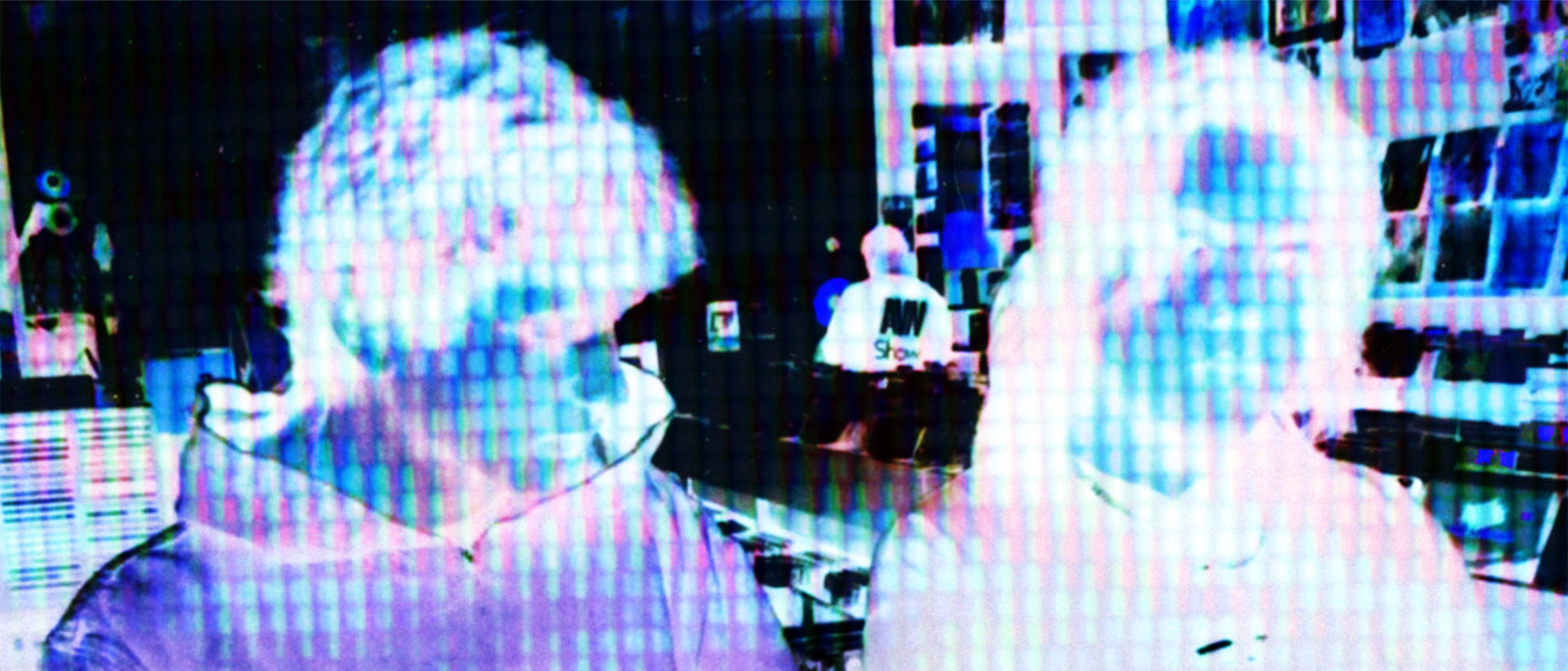 An inverted image of LA-based duo TIDEFORM in a record store.