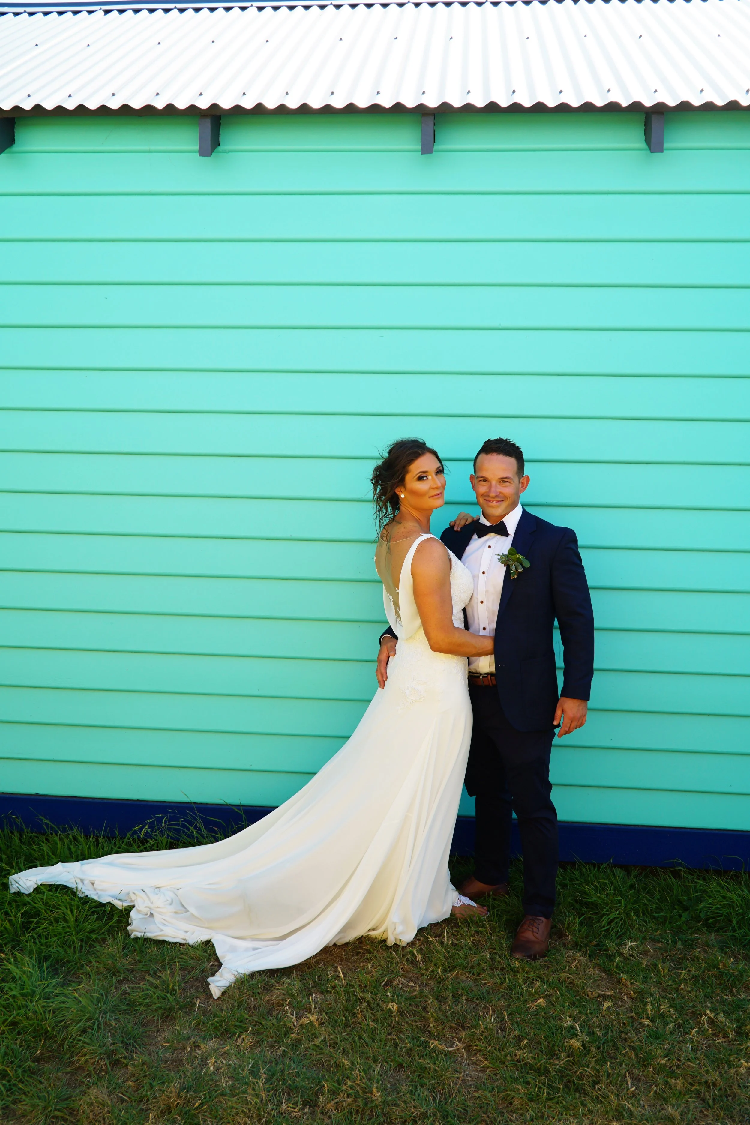 Bec & Tom's in front of a beach box at Blairgowrie Yacht Club