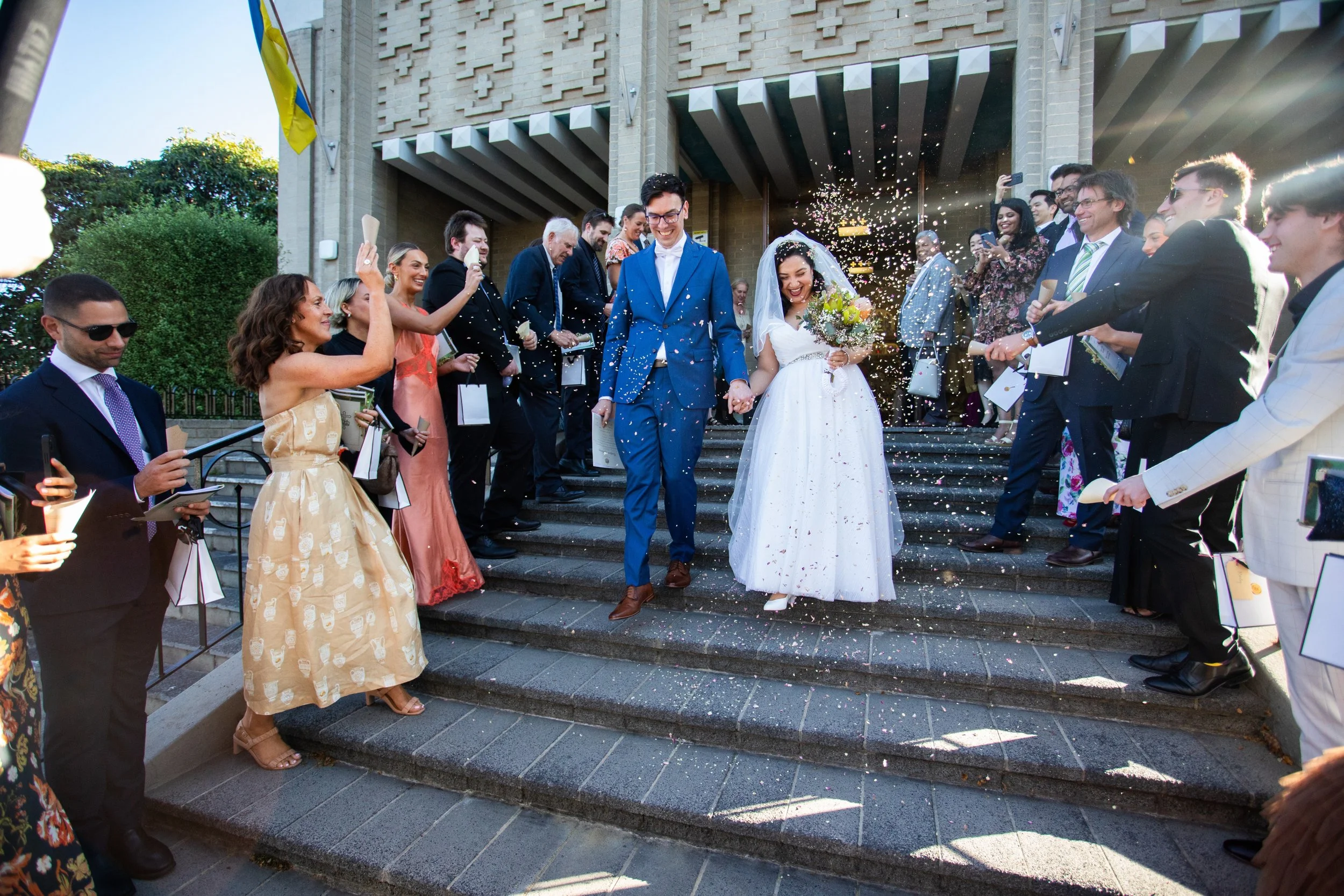 Abha & Andrew's Wedding walking out the church after getting married at Ukrainian Catholic Cathedral of Saints Peter and Paul