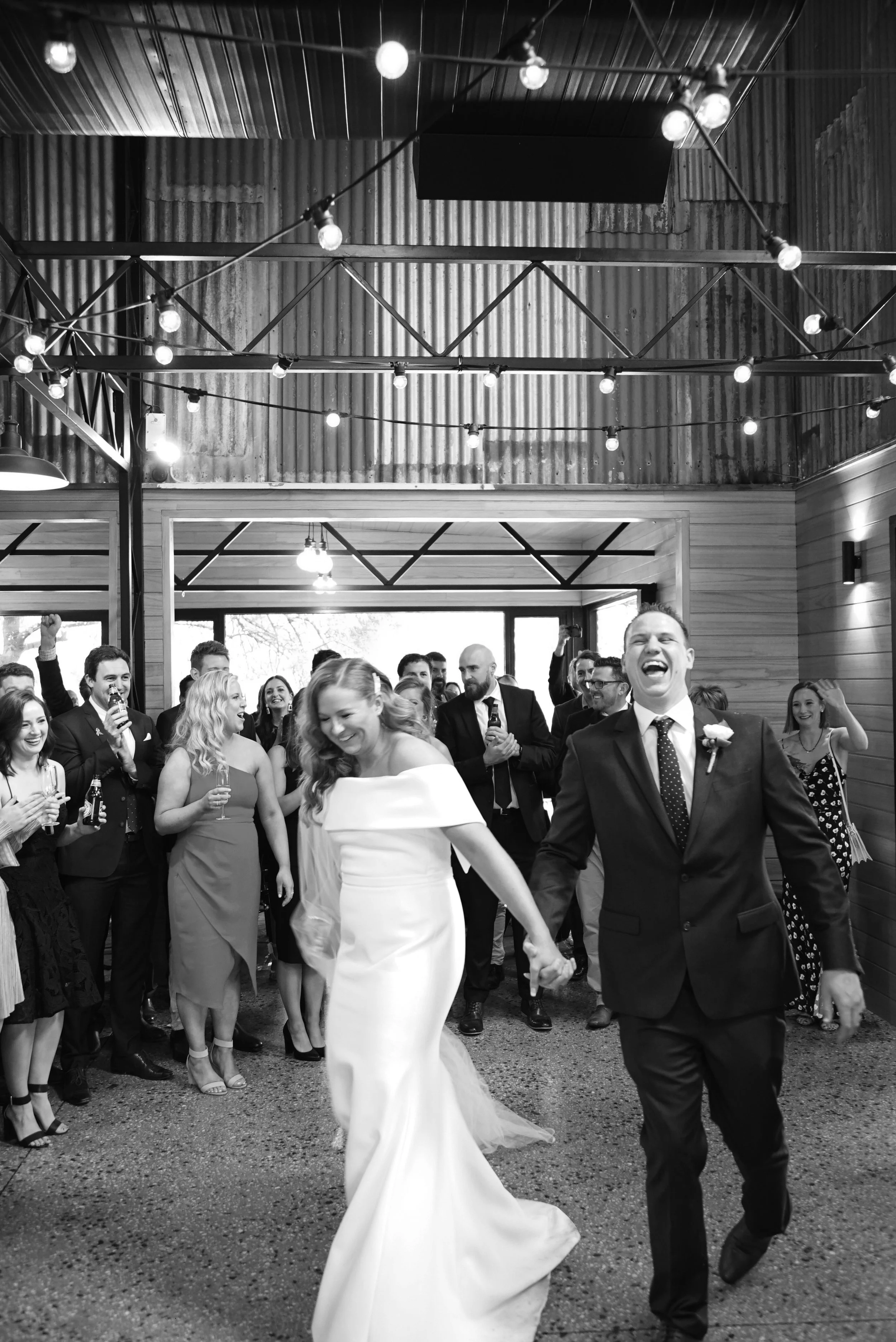 Ash & Luke's Wedding feeling the love as they walk into their reception at Inglewood Estate in Kangaroo Ground